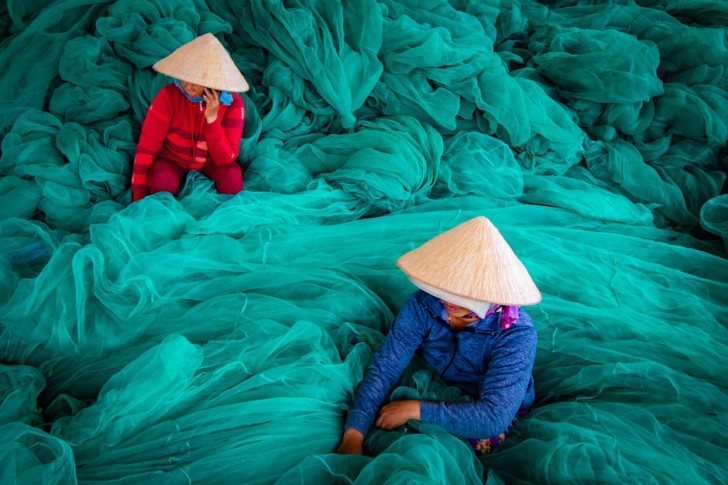 Two Women in Hats in Vietnam
