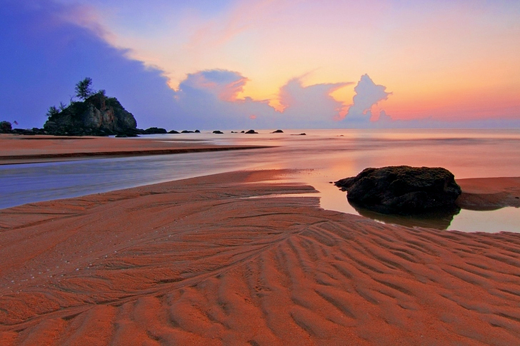 Gray Sand Near Body of Water