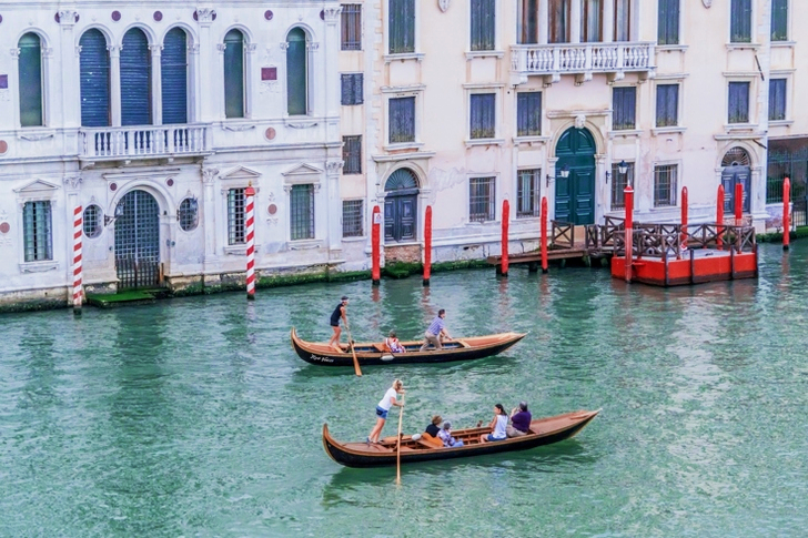 Green Canoe With People Inside