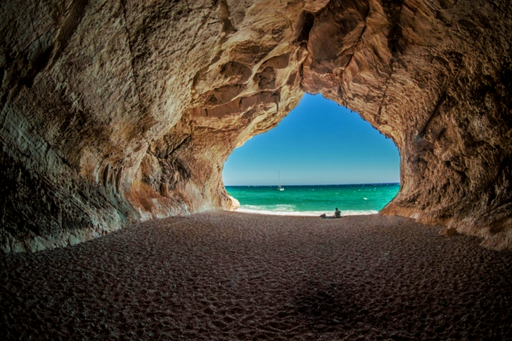 Brown Tunnel Near Body of Water