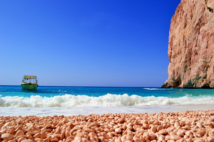 Green and White Boat in Body of Water