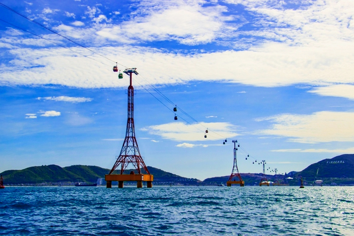 Yellow Cable Car Surrounded by Body of Water