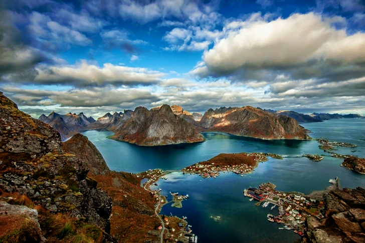 Landscape of Mountains Surrounded by Water