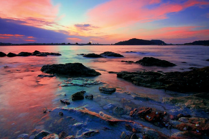 Gray Boulder Surrounded by Body of Water