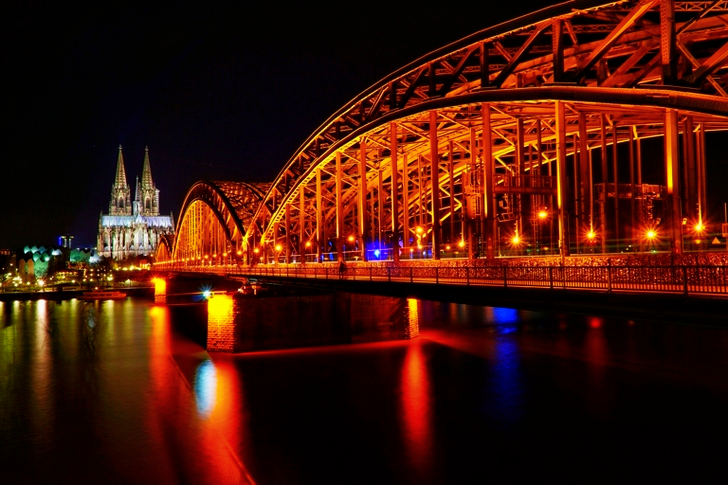 Lighted Bridge and View of Church at Nighttime
