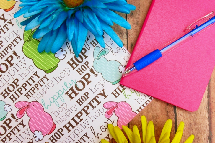 Pink Hardbound Notebook and Blue Ballpoint Pen