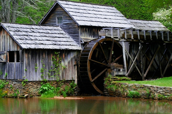 Gray Wooden House With Water Mill Surrounded by Trees