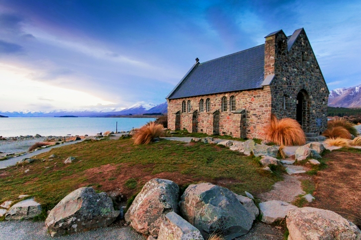 Brown Painted House Near Body of Water