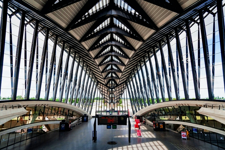 Gray Steel Entrance Gate in Middle of Hallway