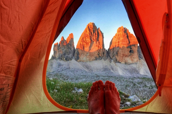 Person Inside Tent Near Mountains
