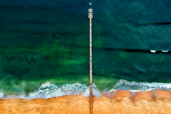Aerial Shot of Gray Dock on Body of Water