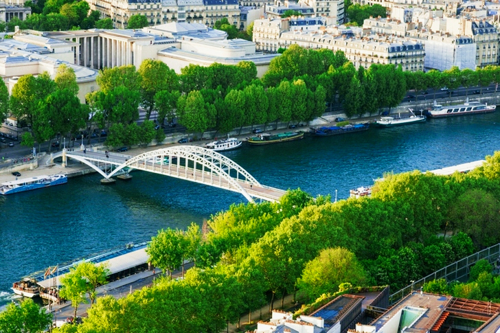 White Steel Bridge on Water Canal in the Middle of City during Day