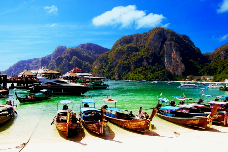 Yellow Wooden Boat Dock on White Sand Beach