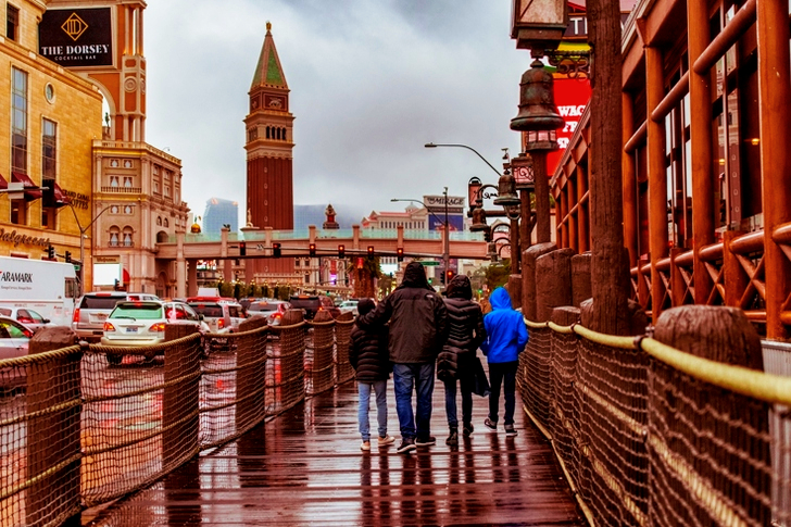 Family Walking Beside Highway