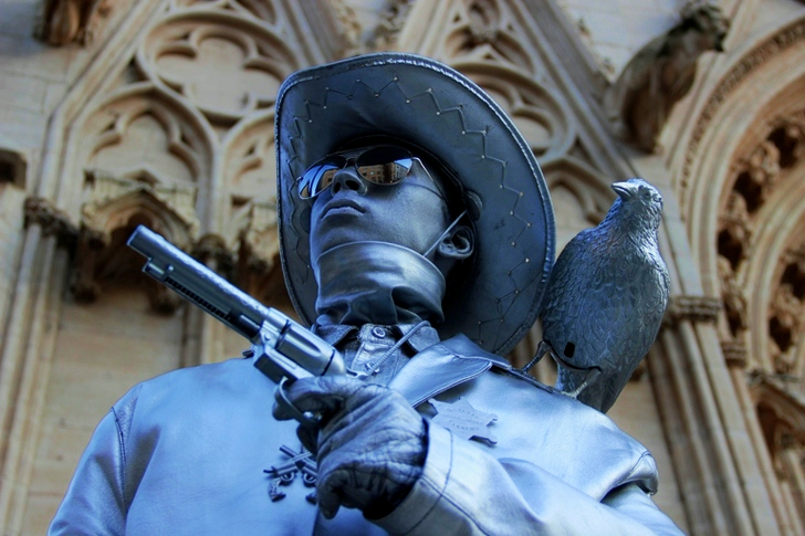 Selective Focus of Cowboy Holding Revolver Pistol Statue