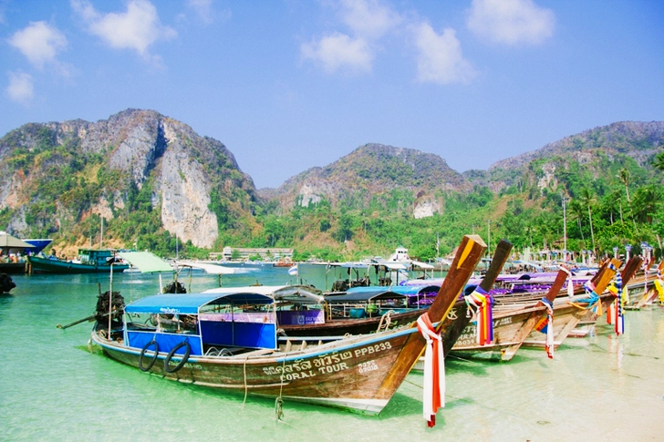 Brown Wooden Boat on Body of Water