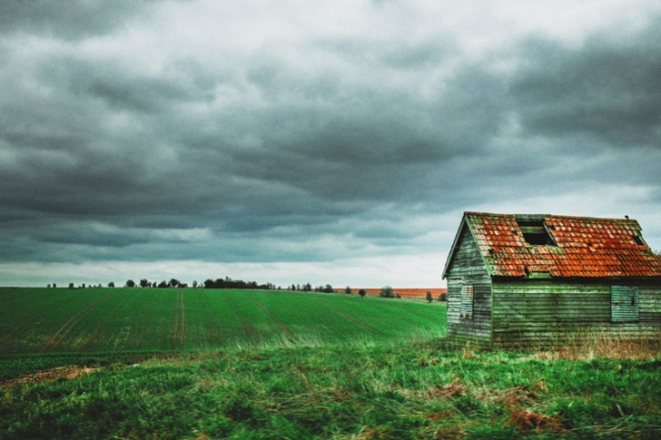 Grey and Brown House Near Green Grass Field