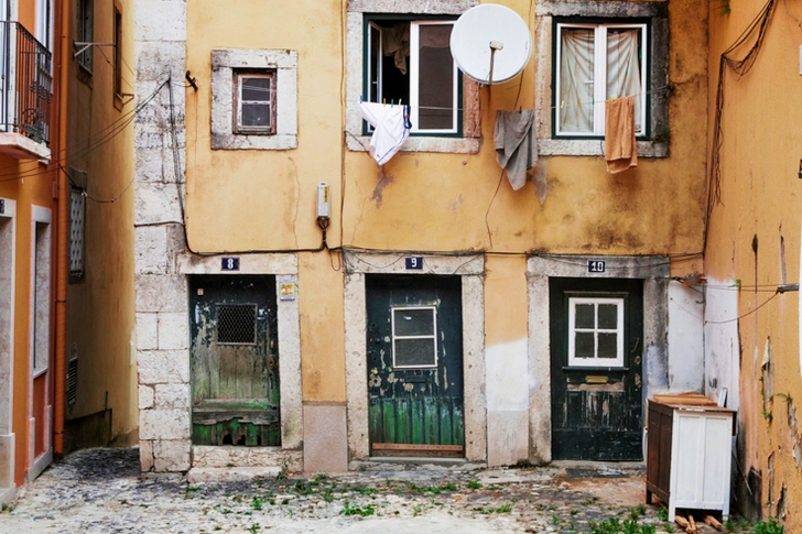 White Parabolic Antenna Beside Brown Concrete Building