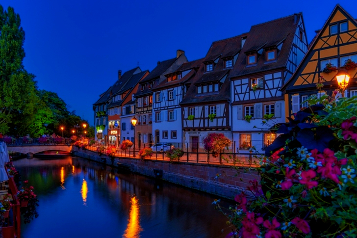 Canal Beside Houses Under Clear Sky