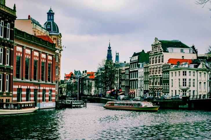 Boat On The Water Near Buildings