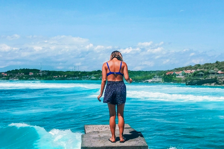 Woman Standing On Dock
