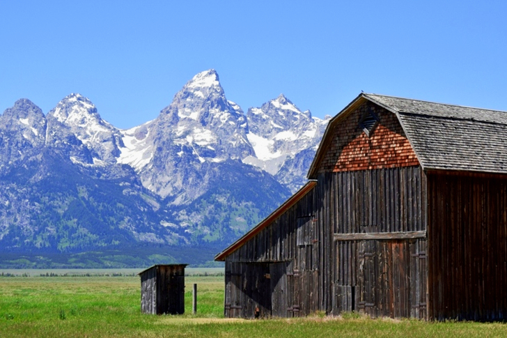 Brown Wooden Shed Near Mountain