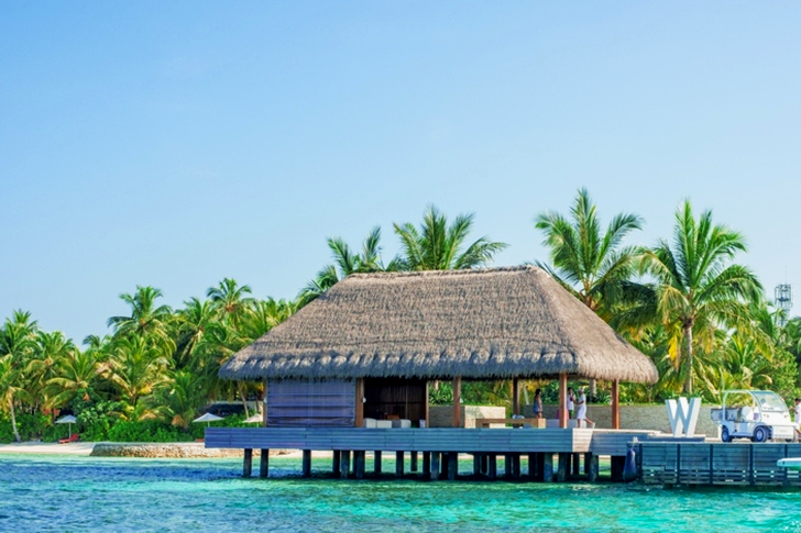 Wooden Cottage Above Water