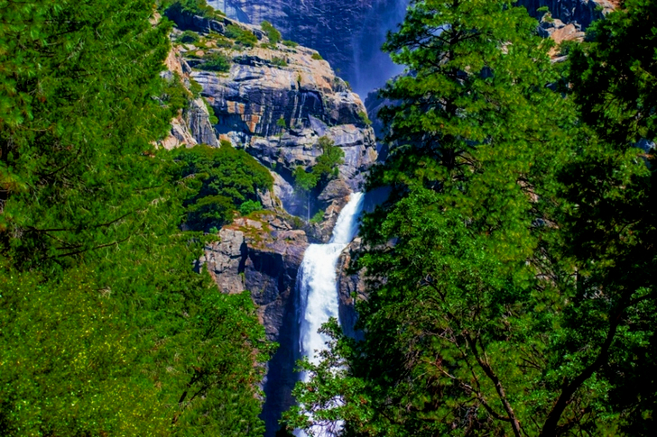 Waterfalls On Rocky Mountain Near Green-leafed Trees
