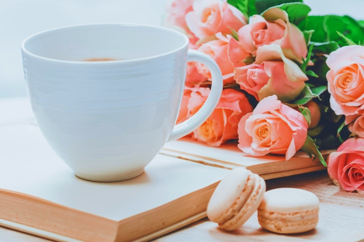 Coffee Mug Near Pink Roses and Macarons