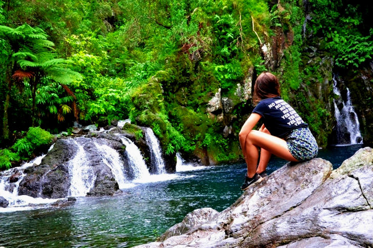 Woman Sitting On Rock