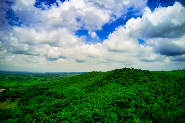 Scenic View Of Mountains Under Cloudy Sky